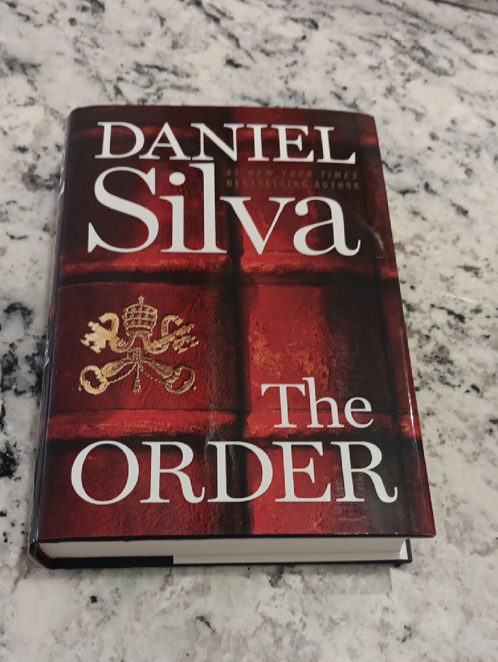 Daniel Silva "The Order" Hardcover Book - Red Cover